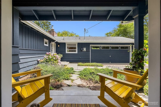 10430 NE Cascade St, Bainbridge Island, WA 98110 - view of patio with a garage
