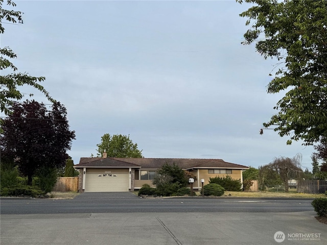18509 22nd Ave E, Tacoma, WA 98445 - ranch-style home featuring an attached garage