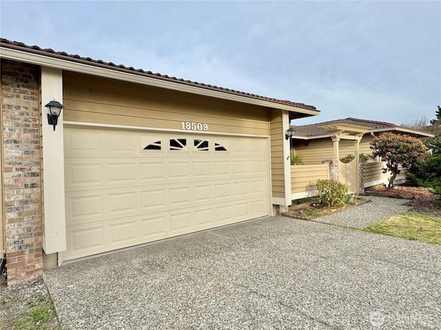 18509 22nd Ave E, Tacoma, WA 98445 - garage featuring asphalt driveway