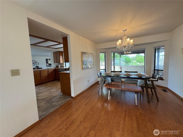 18509 22nd Ave E, Tacoma, WA 98445 - dining space with a chandelier and wood finished floors