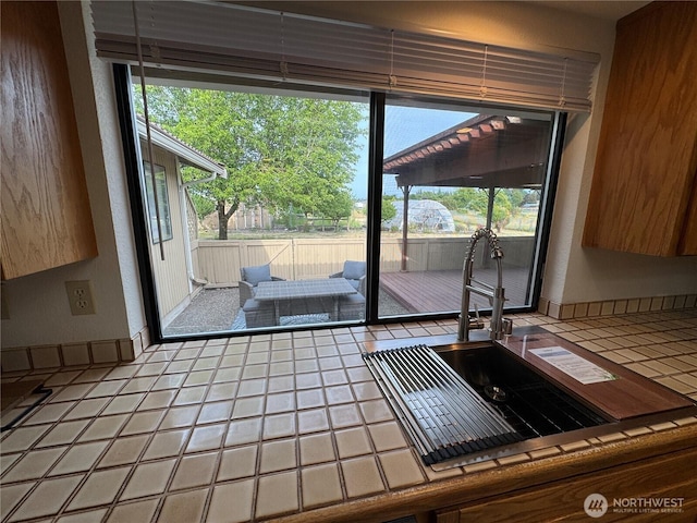 18509 22nd Ave E, Tacoma, WA 98445 - kitchen with tile counters and a sink