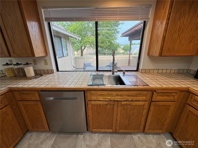 18509 22nd Ave E, Tacoma, WA 98445 - kitchen with dishwasher, tile counters, and healthy amount of natural light