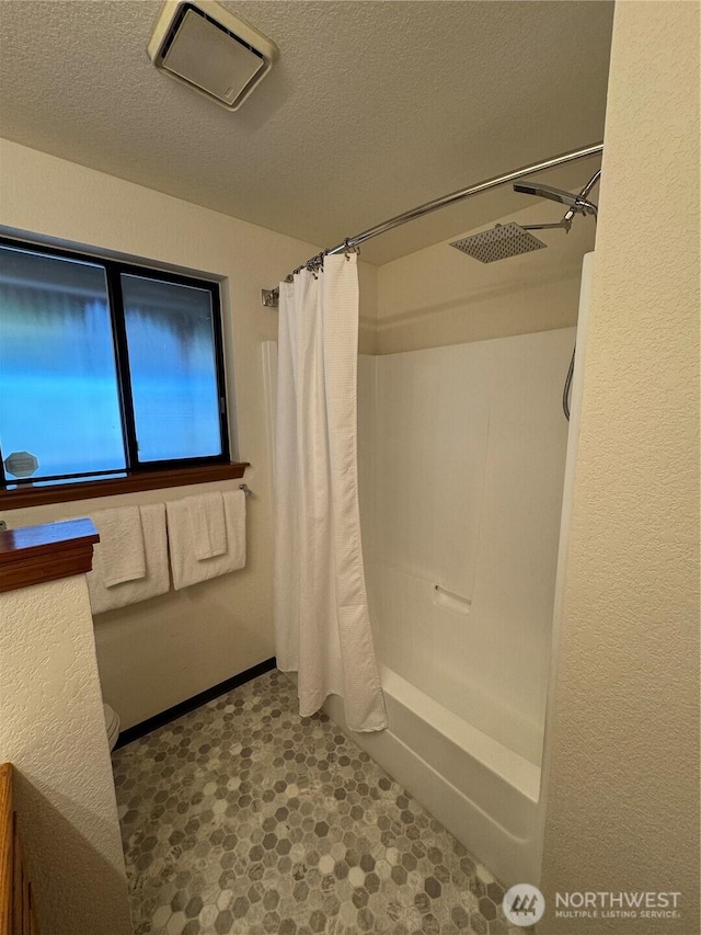 18509 22nd Ave E, Tacoma, WA 98445 - full bath with a textured ceiling and shower / bathtub combination with curtain