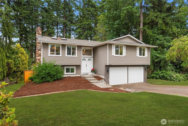 22625 1st Dr SE, Bothell, WA 98021 - split foyer home with a chimney, a front lawn, an attached garage, and concrete driveway