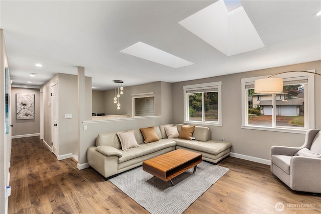 22625 1st Dr SE, Bothell, WA 98021 - living area featuring a skylight, wood finished floors, and recessed lighting
