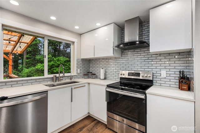 22625 1st Dr SE, Bothell, WA 98021 - kitchen featuring stainless steel appliances, wall chimney range hood, white cabinets, light countertops, and recessed lighting