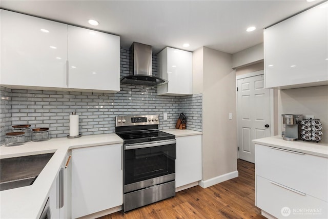 22625 1st Dr SE, Bothell, WA 98021 - kitchen featuring electric range, wall chimney exhaust hood, modern cabinets, white cabinets, and backsplash