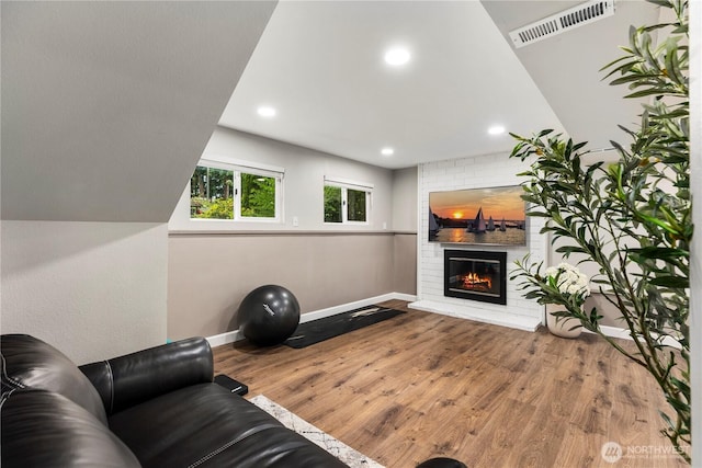 22625 1st Dr SE, Bothell, WA 98021 - living room with wood finished floors, a fireplace, and recessed lighting