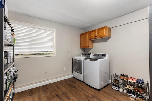 22625 1st Dr SE, Bothell, WA 98021 - washroom with washing machine and dryer, dark wood-style floors, and cabinet space