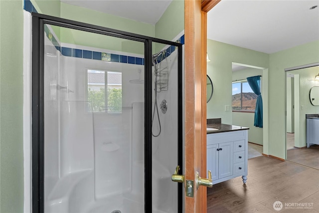 2338 Grand Ave, East Wenatchee, WA 98802 - full bath featuring a stall shower, vanity, and wood finished floors