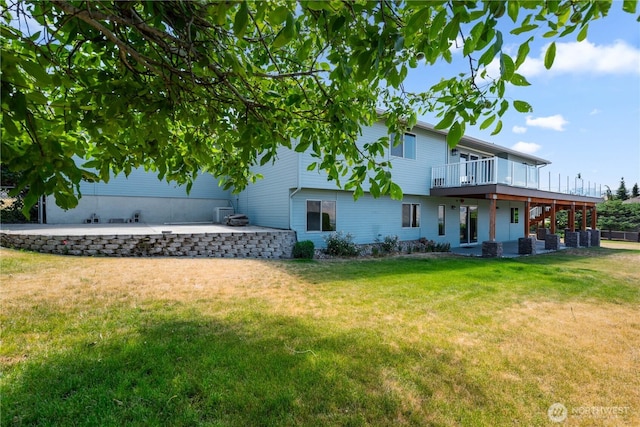 2338 Grand Ave, East Wenatchee, WA 98802 - back of property with a patio, a lawn, and a wooden deck
