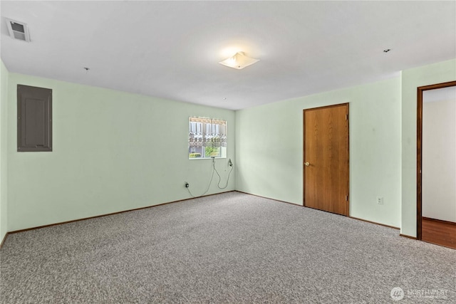 2338 Grand Ave, East Wenatchee, WA 98802 - carpeted spare room featuring electric panel and baseboards