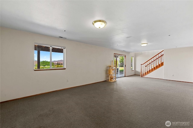 2338 Grand Ave, East Wenatchee, WA 98802 - unfurnished living room with stairway and carpet flooring