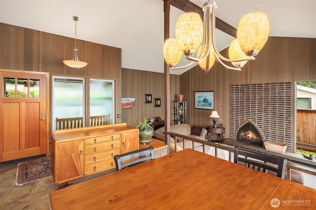 21553 1st Ct S, Normandy Park, WA 98198 - dining space with wooden walls, a tiled fireplace, a chandelier, stone finish flooring, and high vaulted ceiling