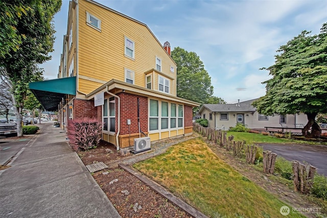 816 Cherry Ave, Sumner, WA 98390 - view of front of home featuring brick siding and a chimney