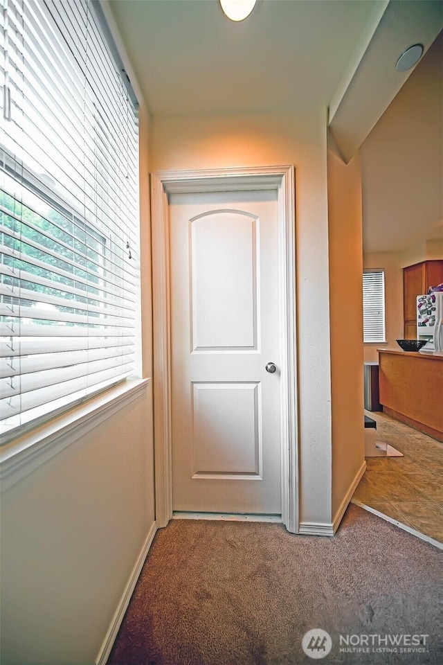 816 Cherry Ave, Sumner, WA 98390 - corridor with carpet floors and healthy amount of natural light