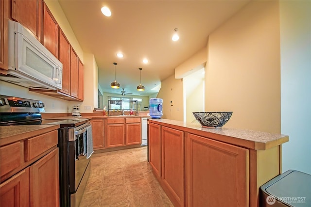816 Cherry Ave, Sumner, WA 98390 - kitchen featuring white appliances, hanging light fixtures, a peninsula, brown cabinets, and recessed lighting