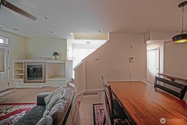 816 Cherry Ave, Sumner, WA 98390 - living room with carpet flooring, a tiled fireplace, and ceiling fan