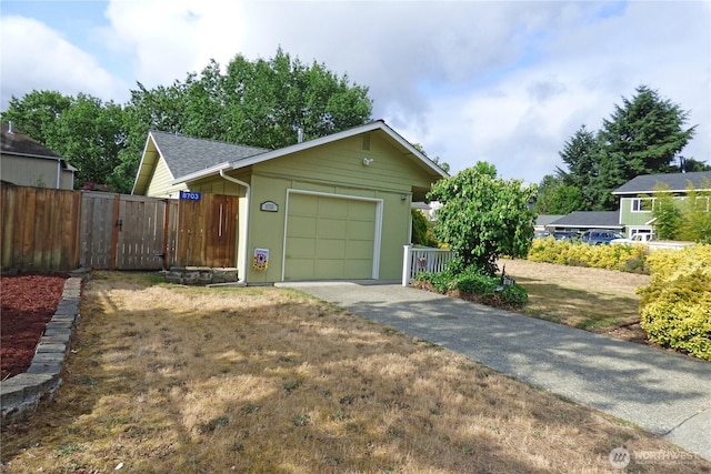 8703 Skokomish Way NE, Olympia, WA 98516 - view of front facade featuring asphalt driveway and a garage