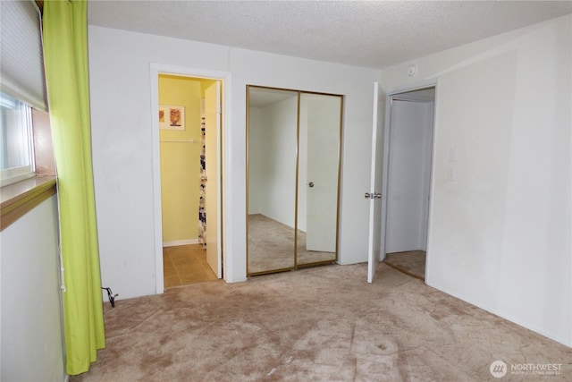 8703 Skokomish Way NE, Olympia, WA 98516 - unfurnished bedroom featuring carpet floors, ensuite bathroom, and a closet