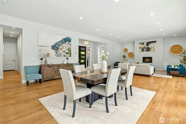 6686 NE Ralston Rd, Bainbridge Island, WA 98110 - dining room with recessed lighting, light wood-style flooring, and a high end fireplace