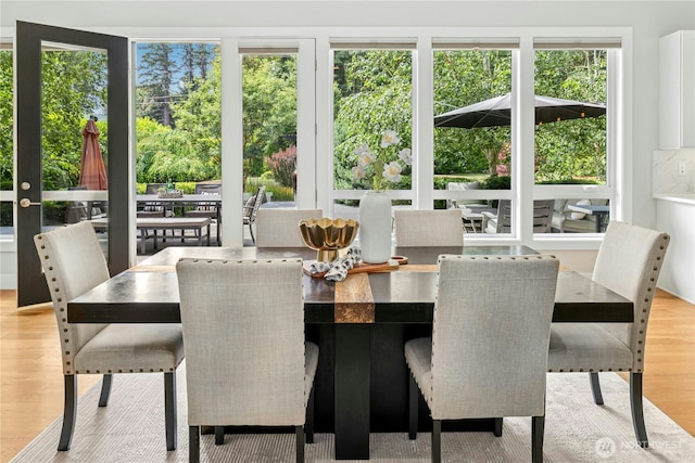 6686 NE Ralston Rd, Bainbridge Island, WA 98110 - dining space featuring healthy amount of natural light and wood finished floors