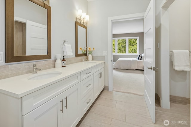 6686 NE Ralston Rd, Bainbridge Island, WA 98110 - full bathroom with double vanity, ensuite bathroom, and decorative backsplash
