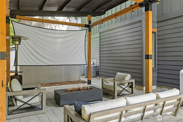 6686 NE Ralston Rd, Bainbridge Island, WA 98110 - view of patio featuring an outdoor living space with a fire pit