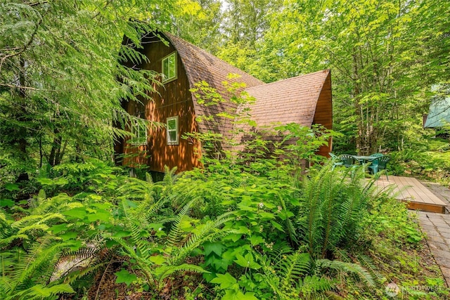 14001 Welcome Rd, Glacier, WA 98244 - view of side of property with a deck and a gambrel roof