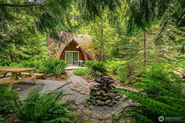 14001 Welcome Rd, Glacier, WA 98244 - view of yard featuring a fire pit, a patio area, and outdoor dining area
