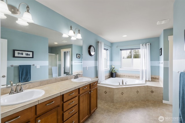 6372 Juanita Cir NE, Bremerton, WA 98311 - bathroom with a garden tub, double vanity, a shower with shower door, and tile patterned flooring