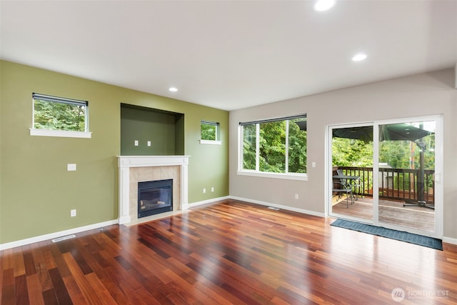 6372 Juanita Cir NE, Bremerton, WA 98311 - unfurnished living room featuring a fireplace, wood finished floors, and recessed lighting