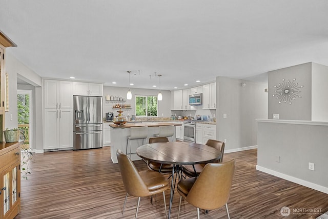 17225 429th Ave SE, North Bend, WA 98045 - dining area featuring dark wood finished floors and recessed lighting