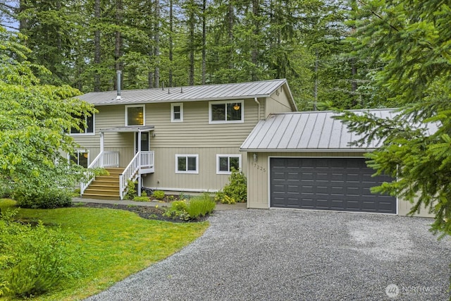 17225 429th Ave SE, North Bend, WA 98045 - view of front of house with a standing seam roof, an attached garage, and a metal roof