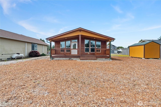 276 Canal Dr NE, Ocean Shores, WA 98569 - view of front facade with a storage shed and a porch