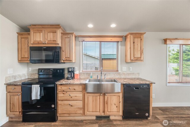 276 Canal Dr NE, Ocean Shores, WA 98569 - kitchen featuring black appliances, light brown cabinetry, dark wood-style flooring, recessed lighting, and light stone countertops