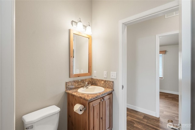 276 Canal Dr NE, Ocean Shores, WA 98569 - bathroom with vanity and wood finished floors