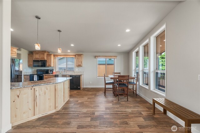 276 Canal Dr NE, Ocean Shores, WA 98569 - kitchen with black appliances, dark wood finished floors, light brown cabinets, recessed lighting, and light stone counters