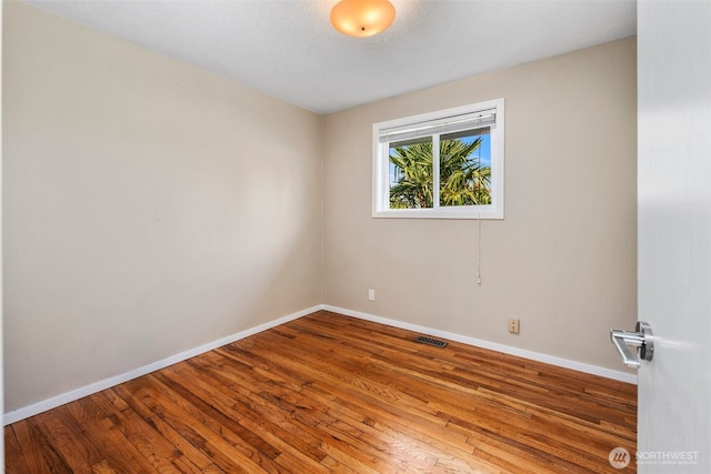 14715 57th Ave S, Tukwila, WA 98168 - spare room with hardwood / wood-style flooring and baseboards