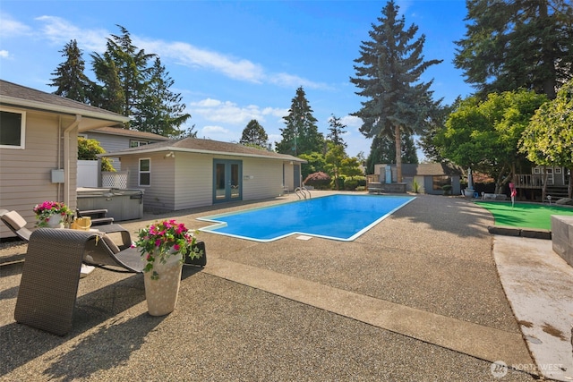 14715 57th Ave S, Tukwila, WA 98168 - swimming pool featuring a hot tub, a patio area, french doors, an outdoor structure, and a storage structure
