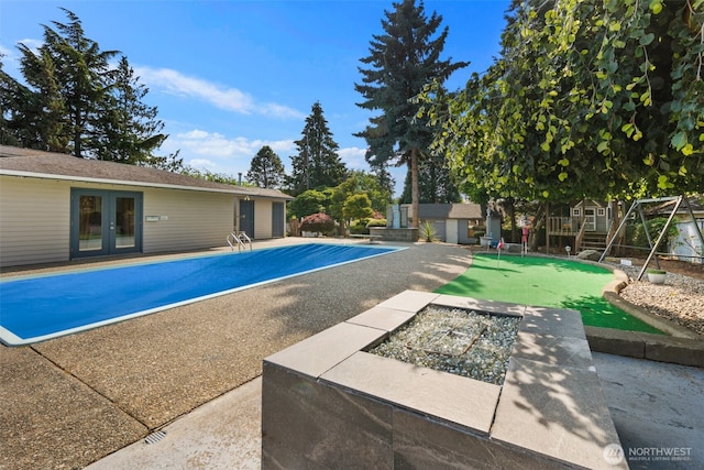 14715 57th Ave S, Tukwila, WA 98168 - swimming pool featuring a putting area, french doors, a patio, and an outdoor fire pit