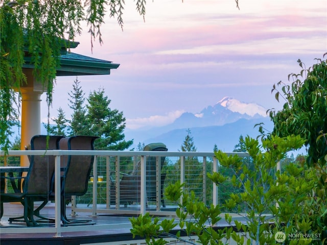7001 Palm Ln, Anacortes, WA 98221 - balcony at dusk featuring a mountain view