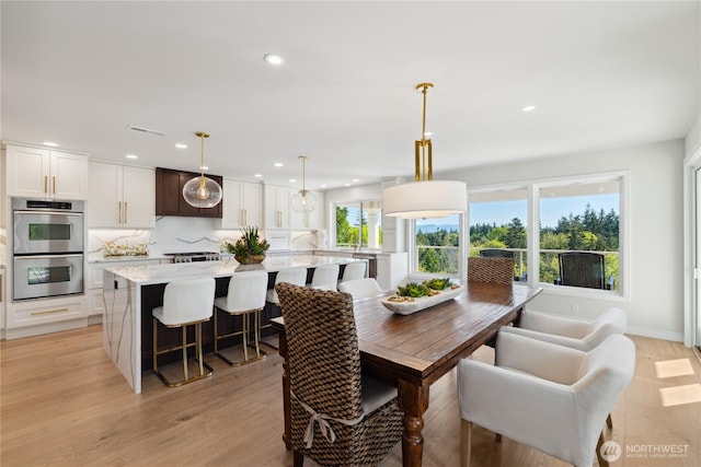 7001 Palm Ln, Anacortes, WA 98221 - dining space featuring light wood-type flooring and recessed lighting