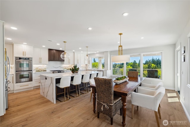 7001 Palm Ln, Anacortes, WA 98221 - dining area with light wood-type flooring and recessed lighting