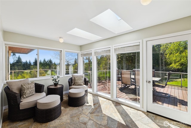 7001 Palm Ln, Anacortes, WA 98221 - sunroom / solarium featuring a skylight, plenty of natural light, and stone finish floors