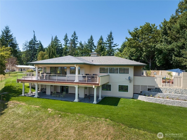 7001 Palm Ln, Anacortes, WA 98221 - back of property featuring a wooden deck, a yard, and a patio