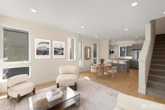 9217B 14th Ave NW, Seattle, WA 98117 - living area featuring stairway, light wood-style floors, and recessed lighting