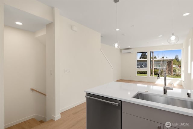 9217B 14th Ave NW, Seattle, WA 98117 - kitchen featuring dishwasher, light wood-type flooring, decorative light fixtures, a wall mounted air conditioner, and recessed lighting