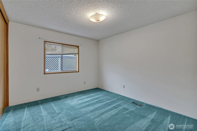 206 Noble Fir Cir, Enumclaw, WA 98022 - empty room with carpet flooring and a textured ceiling