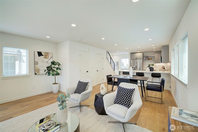 2904 W Bertona St, Seattle, WA 98199 - living room featuring stairway, light wood-style floors, and recessed lighting